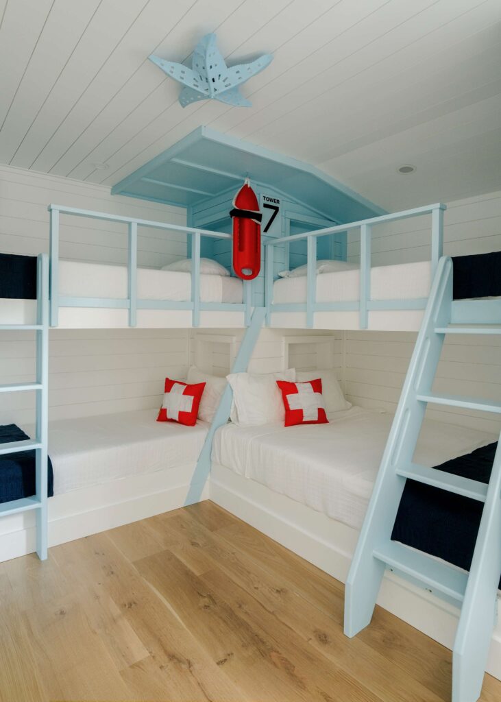 The Seaview Avenue guest room with custom bunk beds and costal decor 